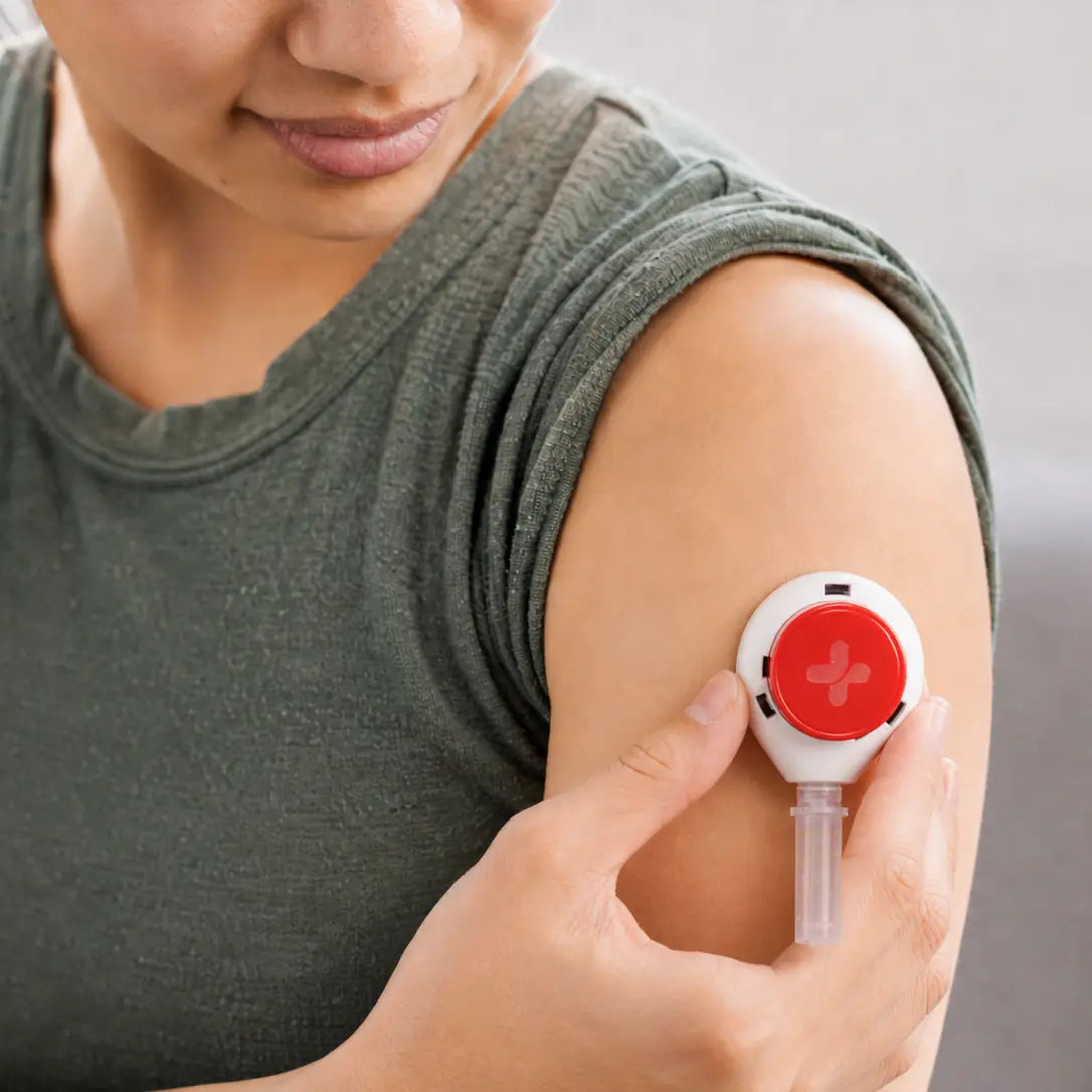 woman placing tasso device on upper arm